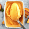 Homemade 3 ingredient peach sorbet served in a rustic bowl