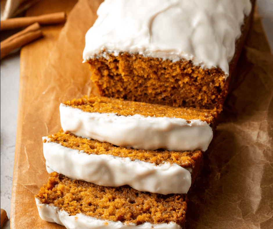 Sliced Pumpkin Bread with Cream Cheese on rustic table