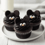 Black Cat Cupcakes with Oreo Ears on white plate