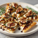Brie and Fig Flatbread Appetizer with golden crust and fig jam