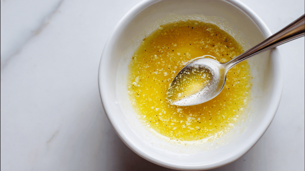 Mixing garlic, butter, and honey