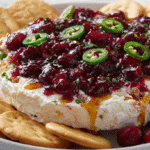 Sweet and Spicy Cranberry Cream Cheese Dip served with crackers