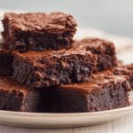 Classic Fudgy Eggless Brownies on ceramic plate