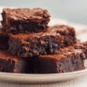 Classic Fudgy Eggless Brownies on ceramic plate
