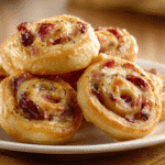 Turkey & Cranberry Pinwheels on parchment paper