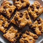 Eggless Chocolate Chip Blondies on white plate