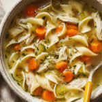 Cozy Healing Chicken Noodle Soup in a rustic ceramic bowl
