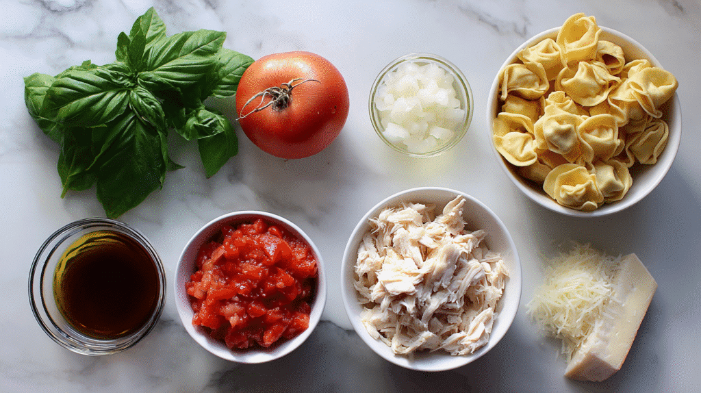 Flat lay of ingredients for Tomato Basil Chicken Tortellini Soup
