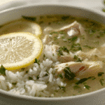 Lemon Ginger Chicken Soup with Rice in white bowl close-up