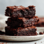 Close-up stack of eggless Oreo brownies on a plate