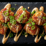 Bang Bang Chicken Bites served with chili sauce and scallions