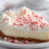 White Chocolate Peppermint Pie topped with whipped cream and crushed candy canes