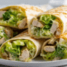 Cheesy Chicken Caesar Wraps close-up on white plate