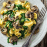 Mushroom Spinach Scrambled Eggs served on a bright plate