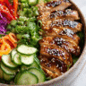 Healthy Asian Inspired Dinner Bowl close-up with fresh toppings