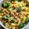 Plate of broccoli chickpea pasta drizzled with garlic olive oil
