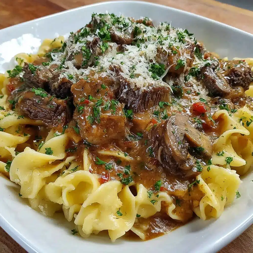 Creamy slow cooker beef stroganoff served over egg noodles