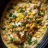 Bowl of slow cooker street corn chicken with fresh herbs and toppings