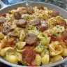 Sticky honey garlic sausage pasta skillet with fresh herbs and spices