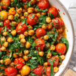 Mediterranean Chickpea Skillet with Spinach in white skillet