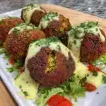 Crispy air fryer falafel served with tahini sauce and fresh veggies