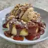 Air fryer banana peanut butter chocolate dessert served on a plate