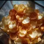 Crispy homemade air fryer potato chips in a bowl