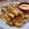 Crispy air-fried zucchini slices seasoned and ready to eat