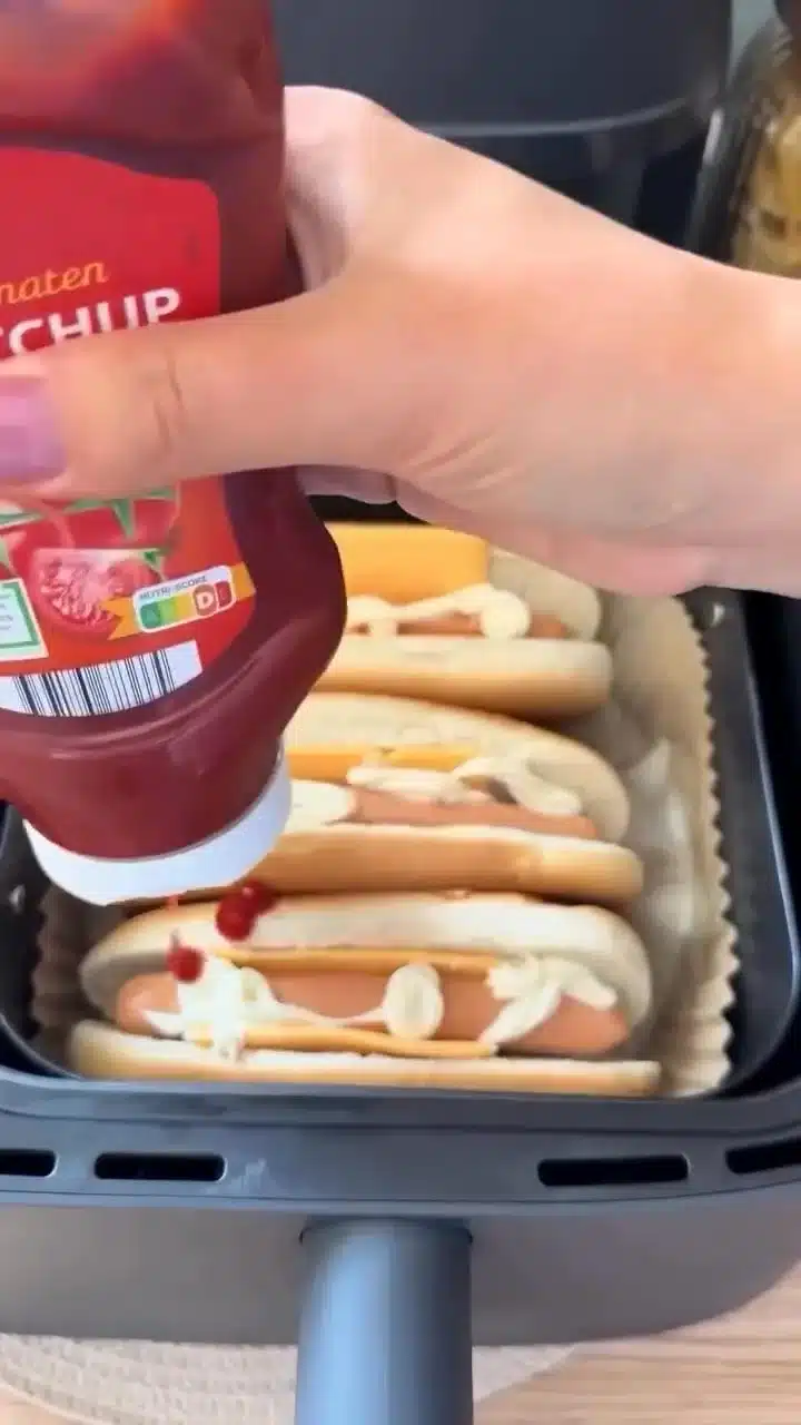 Crispy airfryer hot dogs loaded with toppings served on a plate