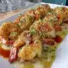 Baked stuffed shrimp dish with herbs and spices, ready to serve.