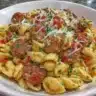 Delicious bowl of Cajun Sausage Pasta with herbs and spices.