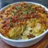 A delicious cheesy hamburger potato casserole served in a baking dish.