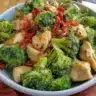 Delicious Chinese chicken and broccoli dish served with rice on a plate
