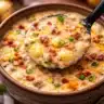 Creamy crockpot cheeseburger soup with ground beef, bacon, and potatoes.