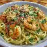 Creamy Tuscan Shrimp Linguine garnished with parsley and served in a bowl