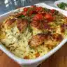 Delicious chicken casserole with spinach and cream cheese in a baking dish.