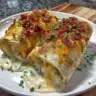 Delicious easy cheesy potato burritos served on a plate with toppings