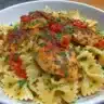 Garlic Butter Chicken served with Bowtie Pasta on a plate