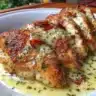 Deliciously roasted Garlic Herb Chicken garnished with fresh herbs