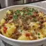 Hearty dish of ground beef and potatoes served in a rustic bowl.