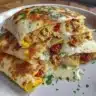 High-protein chicken ranch quesadilla served with toppings