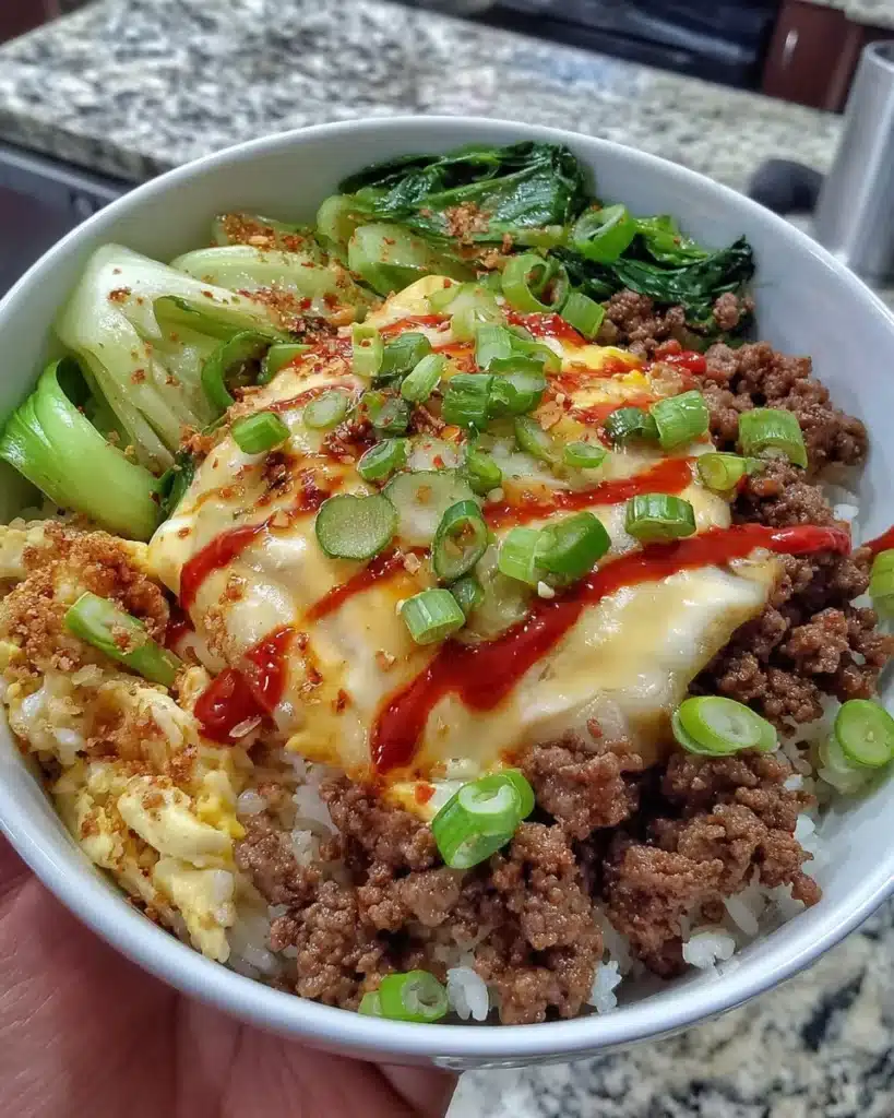 Korean Ground Beef Bowl topped with fresh vegetables and sesame seeds