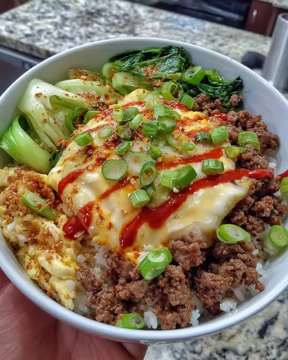 Korean Ground Beef Bowl topped with fresh vegetables and sesame seeds