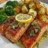Lemon butter salmon with crispy potatoes and broccoli on a plate