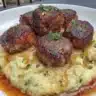 Salisbury steak meatballs served with garlic herb mashed potatoes