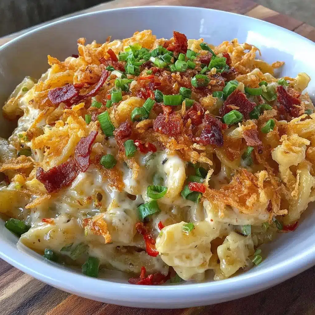 A serving of spicy potato noodles garnished with fresh herbs and chili.