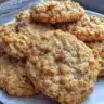 Delicious soft and chewy oatmeal cookies on a plate with chocolate chips