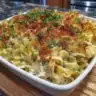 Homemade Tuna Noodle Casserole served in a bowl, garnished with parsley.