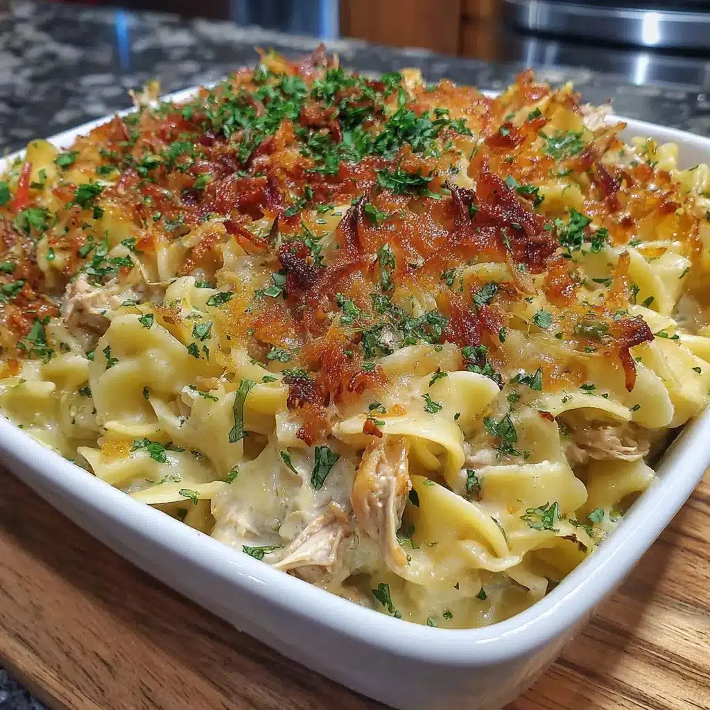 Homemade Tuna Noodle Casserole served in a bowl, garnished with parsley.