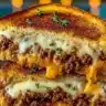 Ultimate Cheesy Ground Beef Melt topped with gooey cheese and delicious seasonings.